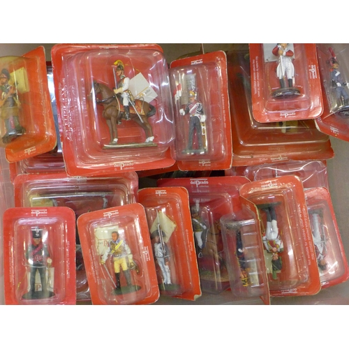 715 - A box of packaged toys, Del Prado soldiers, etc., approximately 43 in total