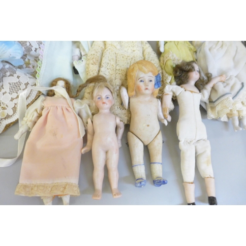 741 - A collection of 19th and early 20th century bisque head dolls together with doll accessories, hats a... 