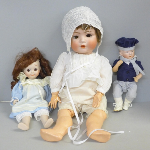 746 - A reproduction J.D. Kestner 221 bisque doll, signed Barbara Hamm 1986, a German bisque head sailor b... 