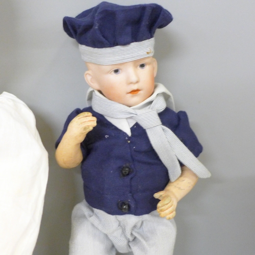 746 - A reproduction J.D. Kestner 221 bisque doll, signed Barbara Hamm 1986, a German bisque head sailor b... 