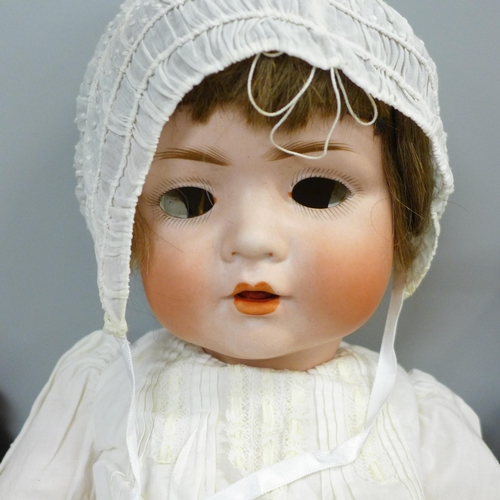 746 - A reproduction J.D. Kestner 221 bisque doll, signed Barbara Hamm 1986, a German bisque head sailor b... 