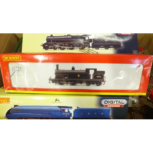 765 - A box with Hornby and other model rail, die-cast model vehicles, including R2895XS BR Black S 45377,... 