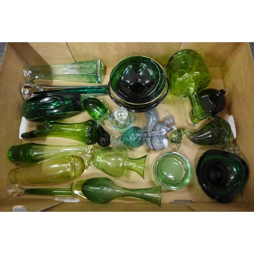 766 - A box of mixed green glass including Czech and Whitefriars; vases, bird figures, scent bottle, etc.