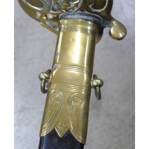 804 - A naval officer's sword with lion head and shagreen handle, scabbard a/f, grooved and etched blade**... 