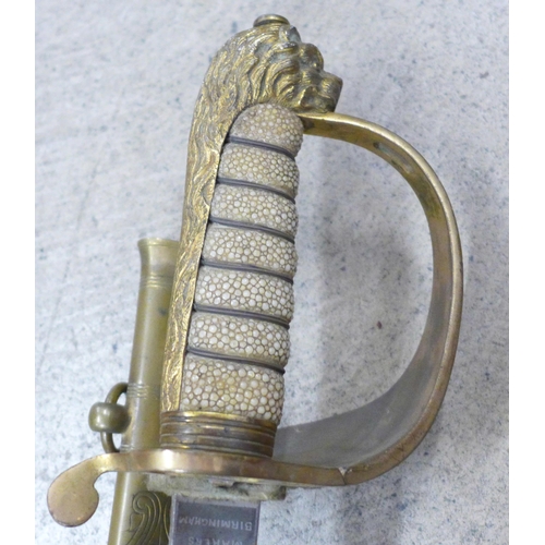 805 - A naval officer's sword with  lion head and shagreen handle, with scabbard, the blade marked Robert ... 