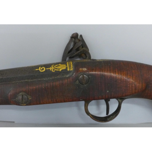 821 - A large flintlock pistol, marked London, a/f, 58cm **PLEASE NOTE THIS LOT IS NOT ELIGIBLE FOR IN-HOU... 