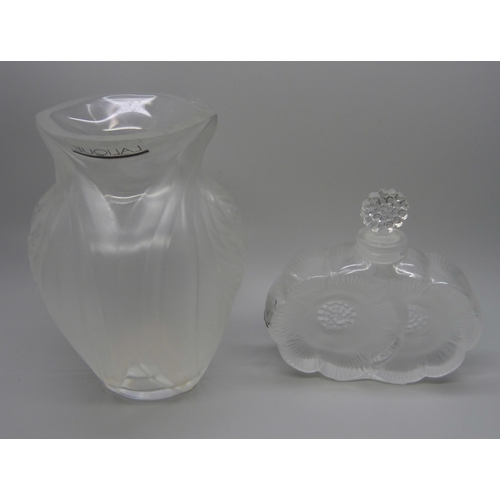 824 - A Lalique perfume bottle, a Lalique vase, 12.5cm, and two Lalique blue crystal perfume bottles, lack... 