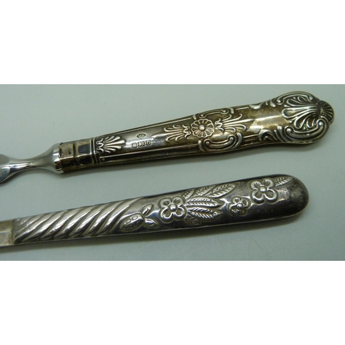 859 - A silver letter opener, London 1977 import mark, 19g, and a letter opener with silver covered handle