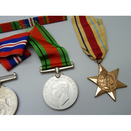 871 - A set of five WWII medals and miniatures to C277210 H.W. Martin