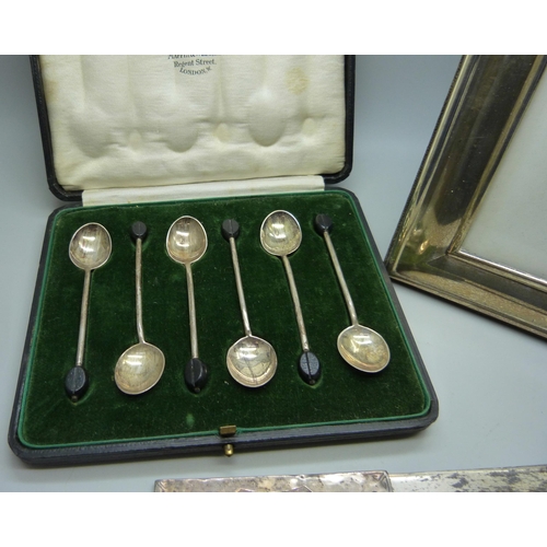 896 - A cased set of six silver Mappin & Webb coffee bean spoons, a silver photograph frame, 17.5 x 22.5cm... 