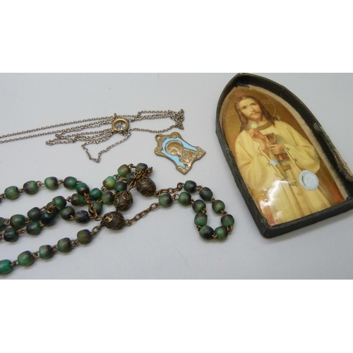 906 - A large silver and amber cross pendant, Rosary beads, etc.