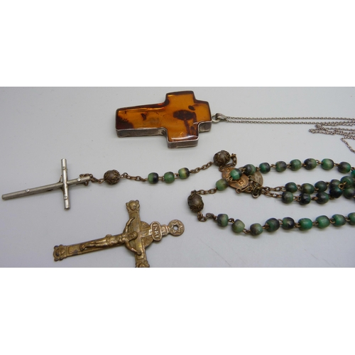 906 - A large silver and amber cross pendant, Rosary beads, etc.