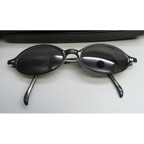 919 - A pair of Ray-Ban sunglasses and two pairs of Ralph Lauren sunglasses, all with cases