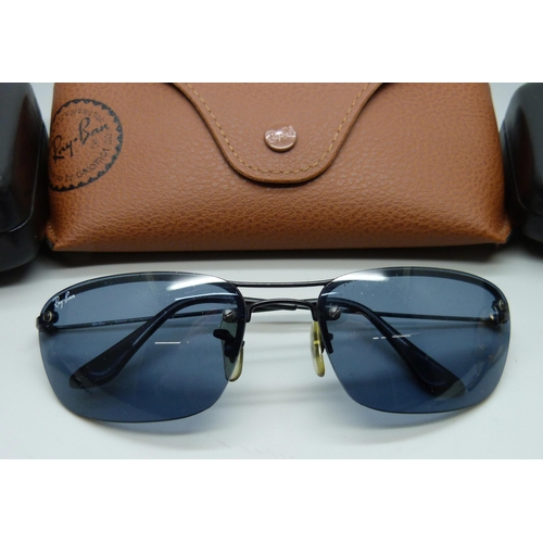 919 - A pair of Ray-Ban sunglasses and two pairs of Ralph Lauren sunglasses, all with cases