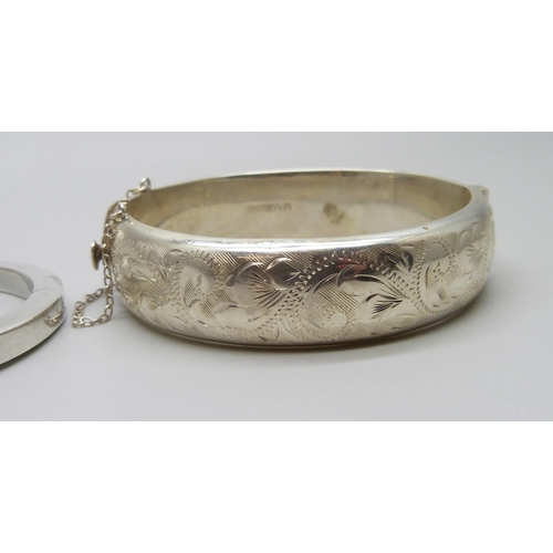 932 - Three silver bangles, 49g