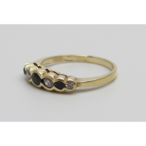 967 - A 9ct gold, sapphire and white stone ring, 1.8g, L