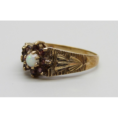 968 - A 1970s 9ct gold, opal and garnet ring, London 1977, 3.2g, R