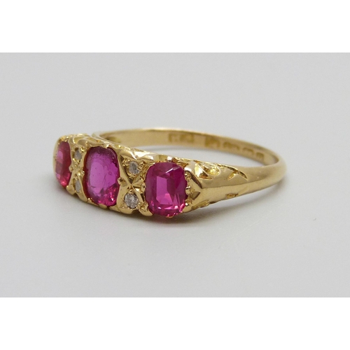 974 - An 18ct yellow gold diamond and pink stone ring, Birmingham 1912, 3.2g, O/P