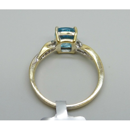 976 - A silver gilt topaz and zircon ring, S