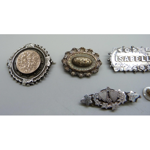 984 - Six brooches; three Victorian hallmarked silver, horseshoe, name brooch and small brooch with heart ... 