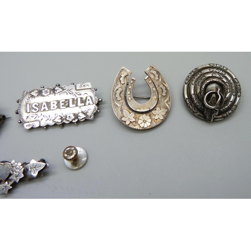 984 - Six brooches; three Victorian hallmarked silver, horseshoe, name brooch and small brooch with heart ... 