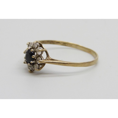 991 - A 9ct gold, sapphire and white stone cluster ring, 0.9g, P