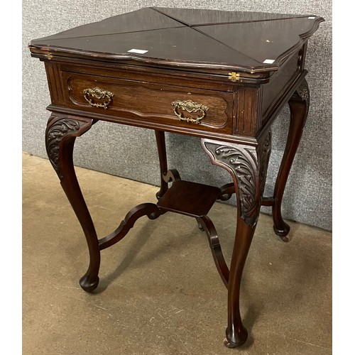 97 - An Edward VII mahogany envelope games table