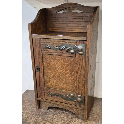 326 - An Art Nouveau oak smokers cabinet