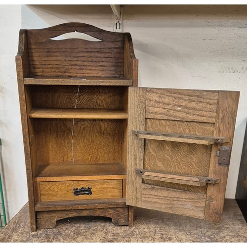 326 - An Art Nouveau oak smokers cabinet