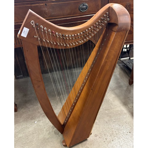 339 - A mahogany harp, cased