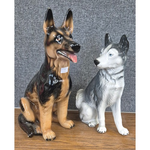 347 - Two continental fireside figures of dogs, German Shepherd and Husky