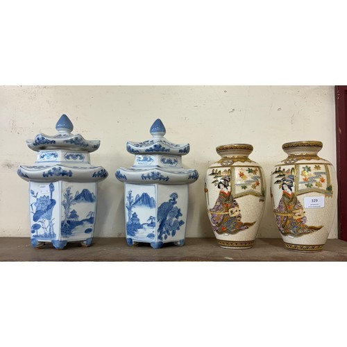 329 - A pair of Japanese Kusube Satsuma vases and a pair of blue biscuit jars