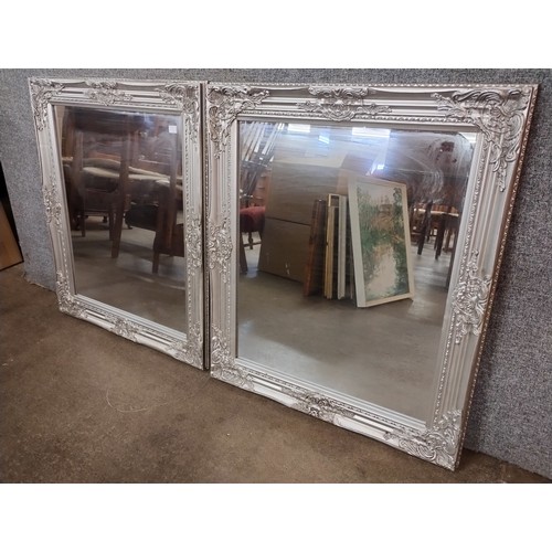 315A - A pair of Victorian style silver effect framed mirrors