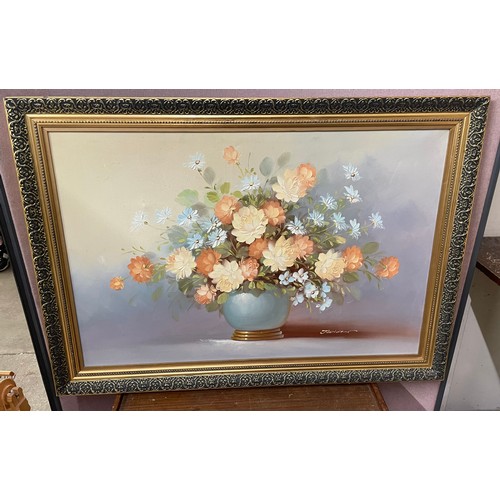 315 - A gilt framed overmantel mirror and an oil painting, still life of lowers, oil on board, signed John... 