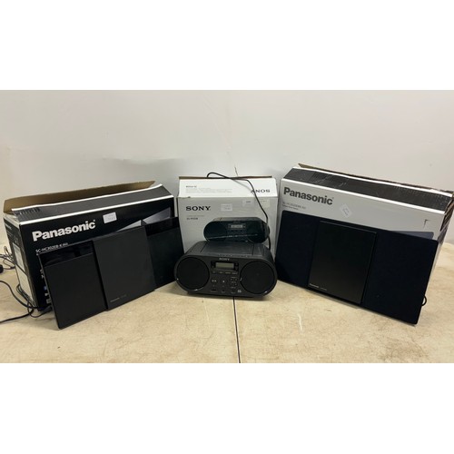 2095 - A Panasonic SC-HC2020 EBK compact stereo system, a Panasonic SC-HC302EB-K compact stereo system and ... 