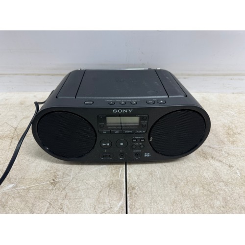 2095 - A Panasonic SC-HC2020 EBK compact stereo system, a Panasonic SC-HC302EB-K compact stereo system and ... 