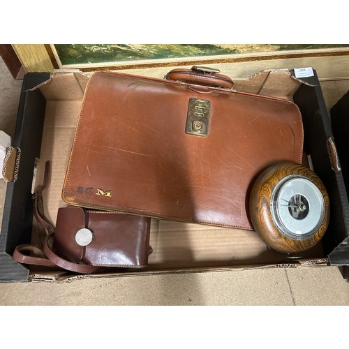 304 - A leather briefcase, an oak aneroid barometer and a camera in leather case