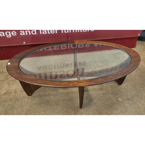 5 - A G-Plan Astro teak and glass topped oval coffee table