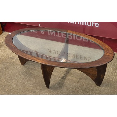 5 - A G-Plan Astro teak and glass topped oval coffee table