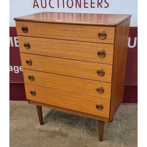 9 - A teak chest of drawers