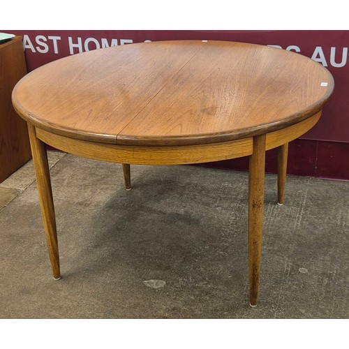 11 - A G-Plan Fresco teak circular extending dining table