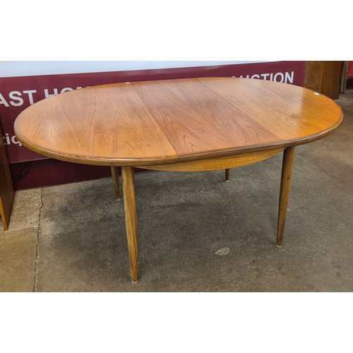 11 - A G-Plan Fresco teak circular extending dining table