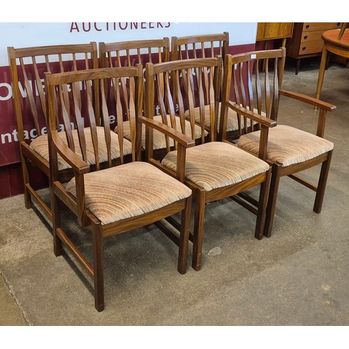 21 - A set of six teak dining chairs