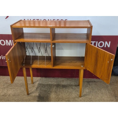 18 - A teak two door record cabinet