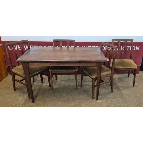 28 - A Younger teak extending dining table and four chairs, designed by John Herbert