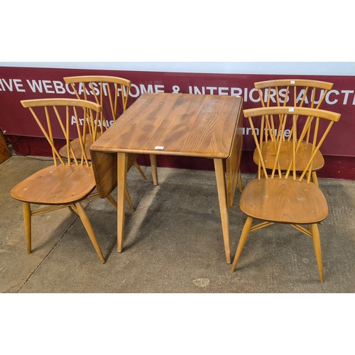 33 - An Ercol Blonde elm and beech drop leaf table and four 376 model candlestick back chairs