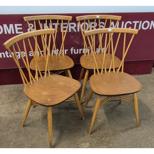 33 - An Ercol Blonde elm and beech drop leaf table and four 376 model candlestick back chairs