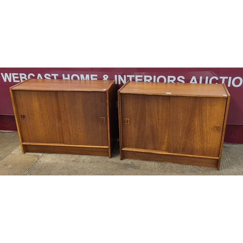 35 - A pair of Swedish teak sliding two door cabinets