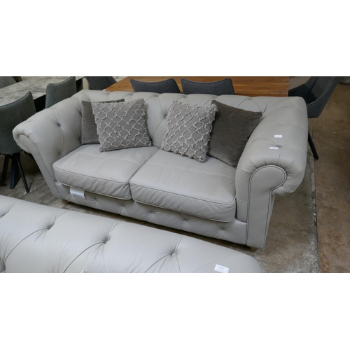 1301 - A stone leather Chesterfield three seater sofa RRP £1499