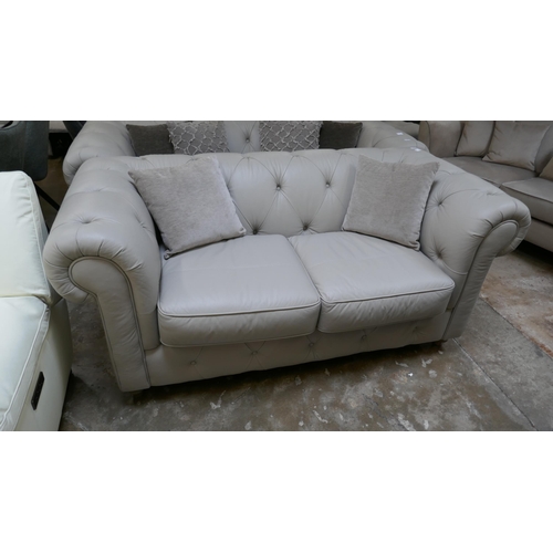 1302 - A stone leather Chesterfield 2.5 seater sofa RRP £1379